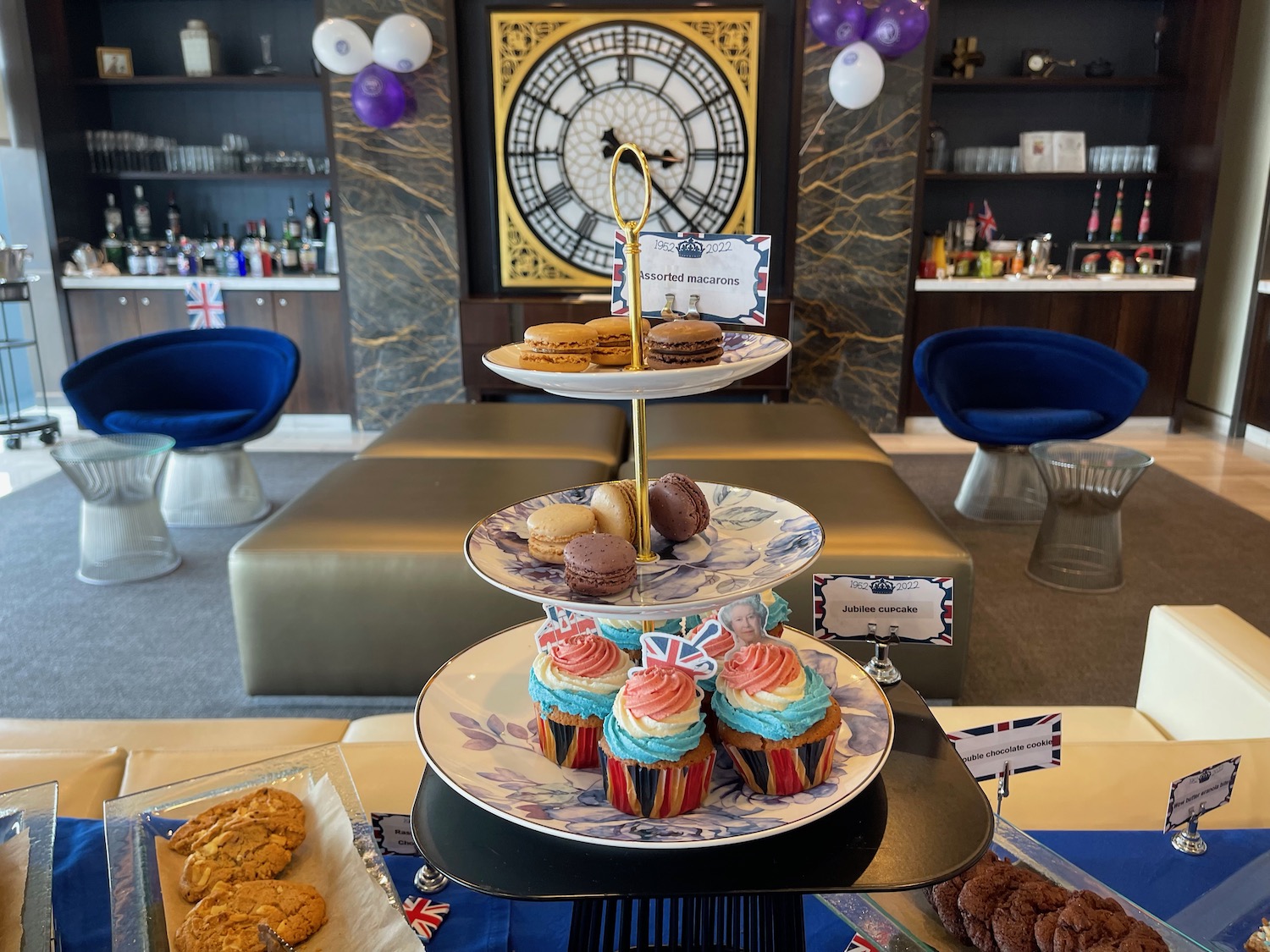 a tray of cupcakes and cookies on a table