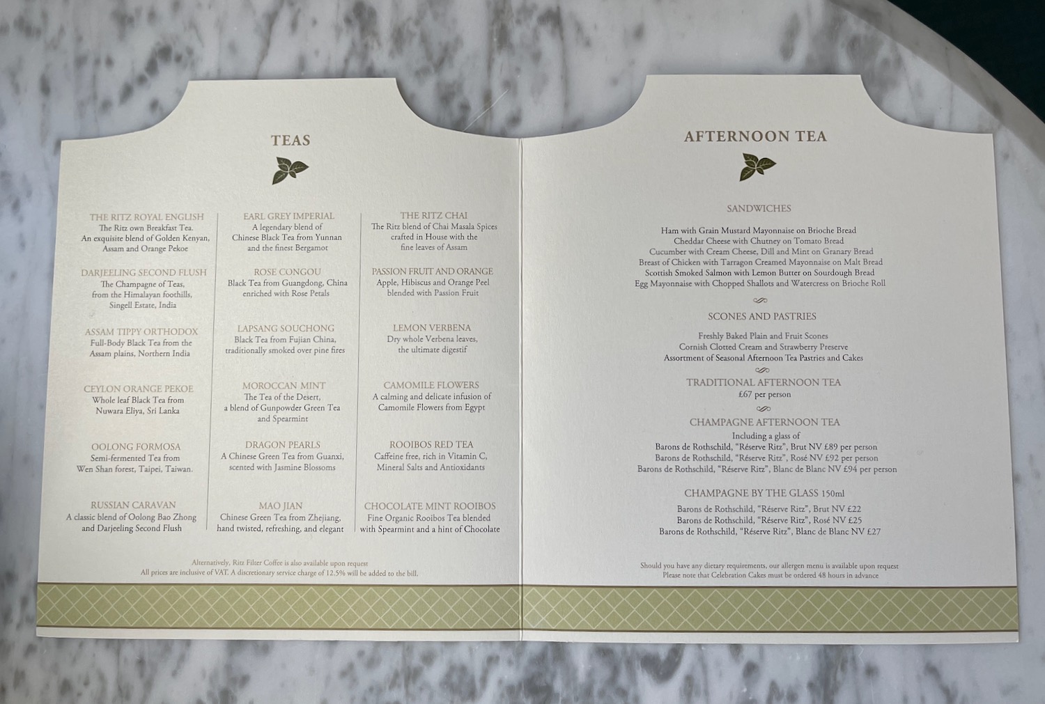 a menu on a marble surface