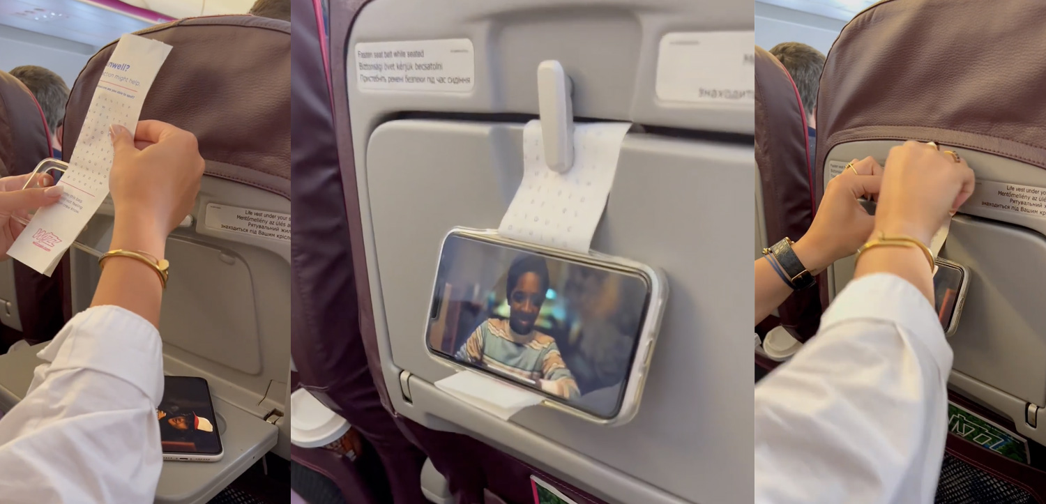 a phone on the seat of an airplane