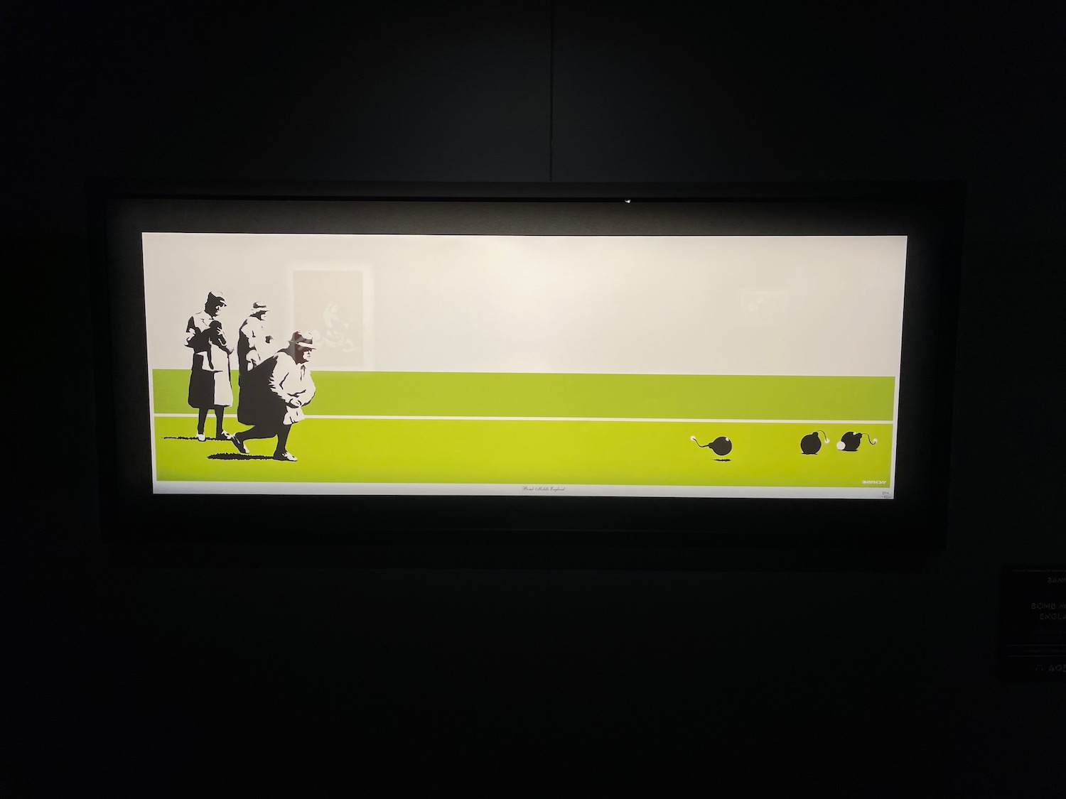a screen with a picture of people walking on a tennis court