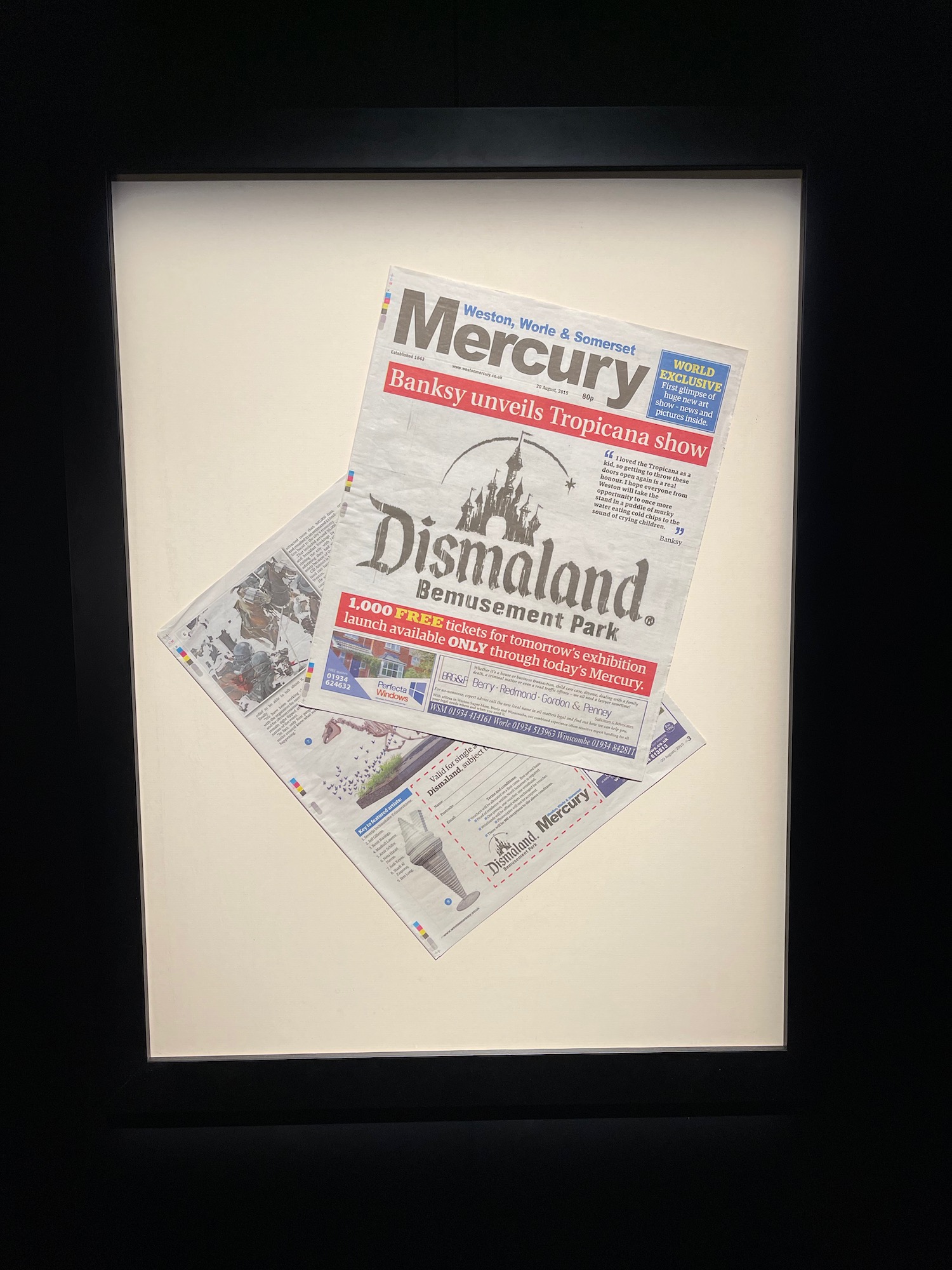 a newspaper in a frame