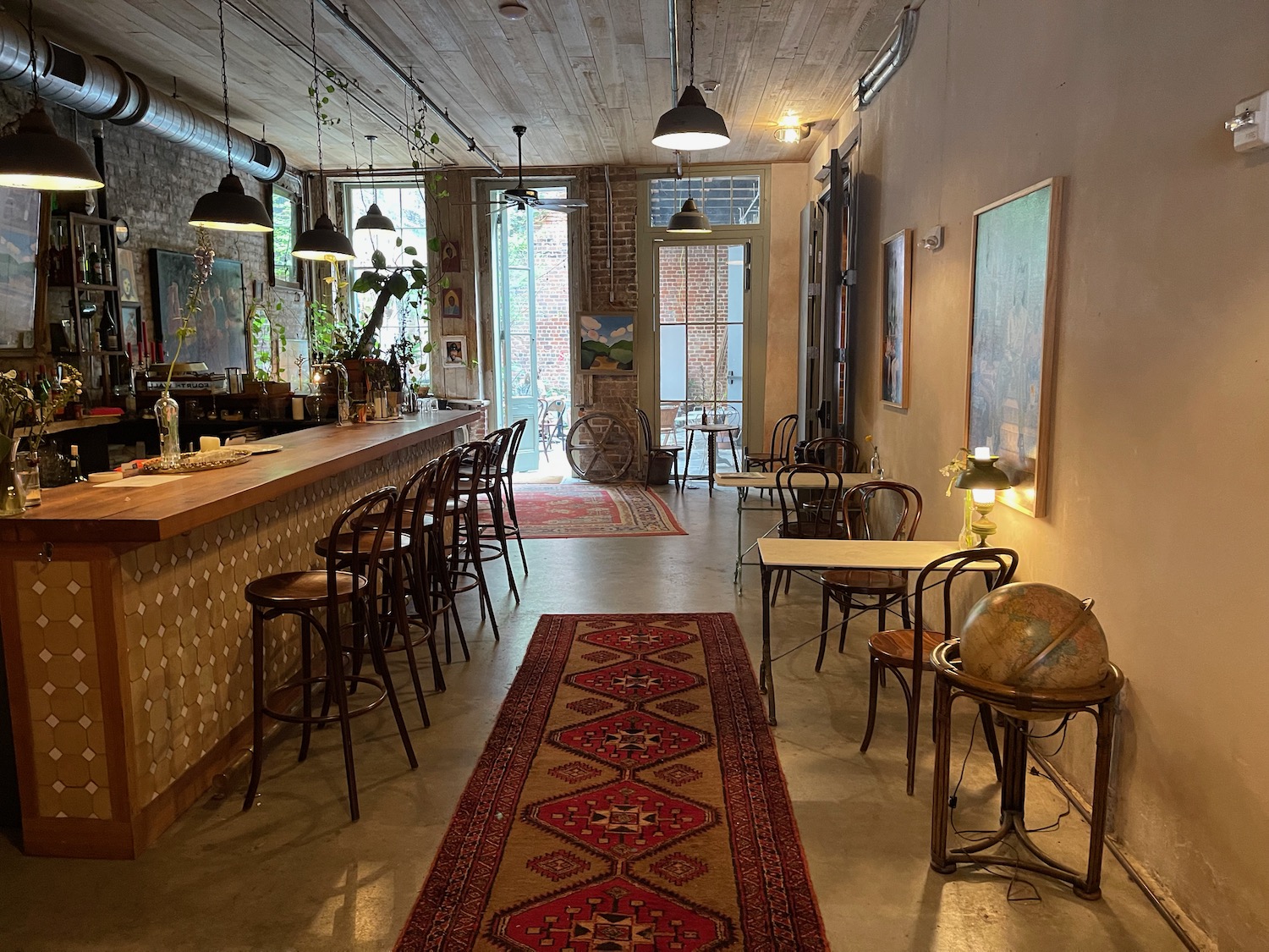 a room with a long table and chairs