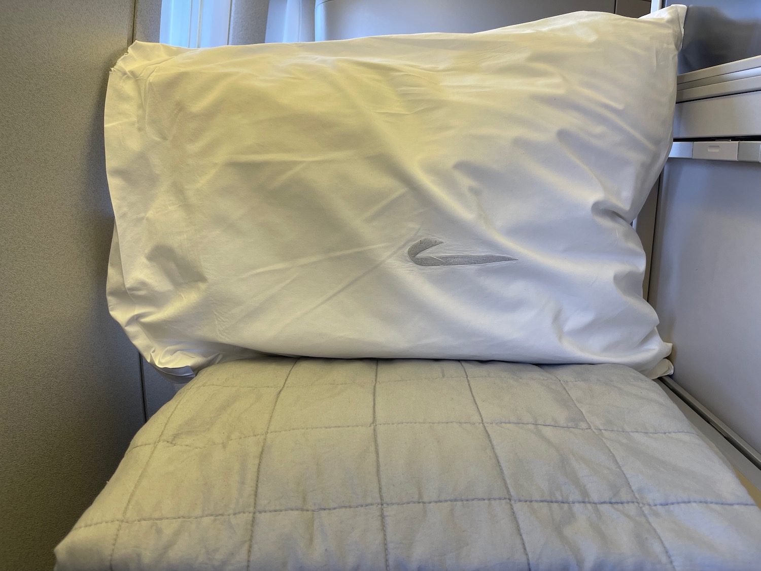 a pillow on a bed