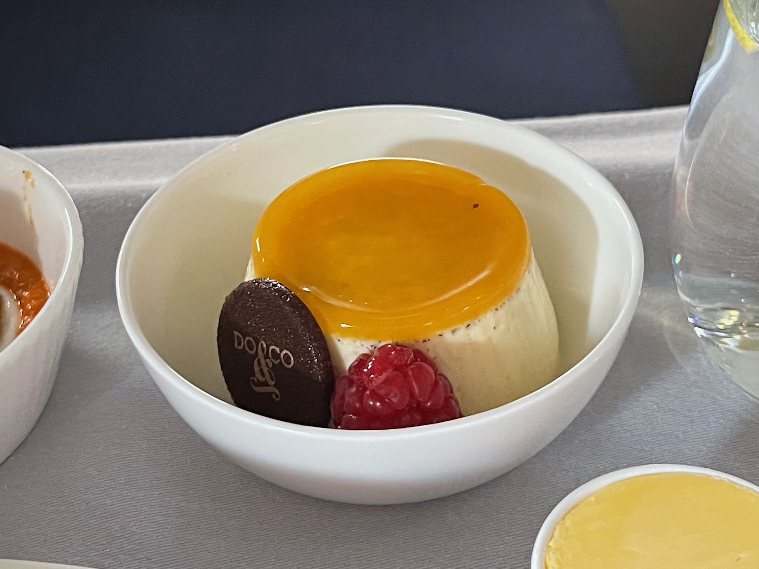 a bowl of dessert with a piece of fruit