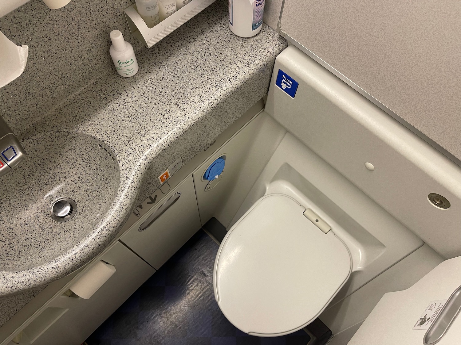 a toilet and sink in a bathroom