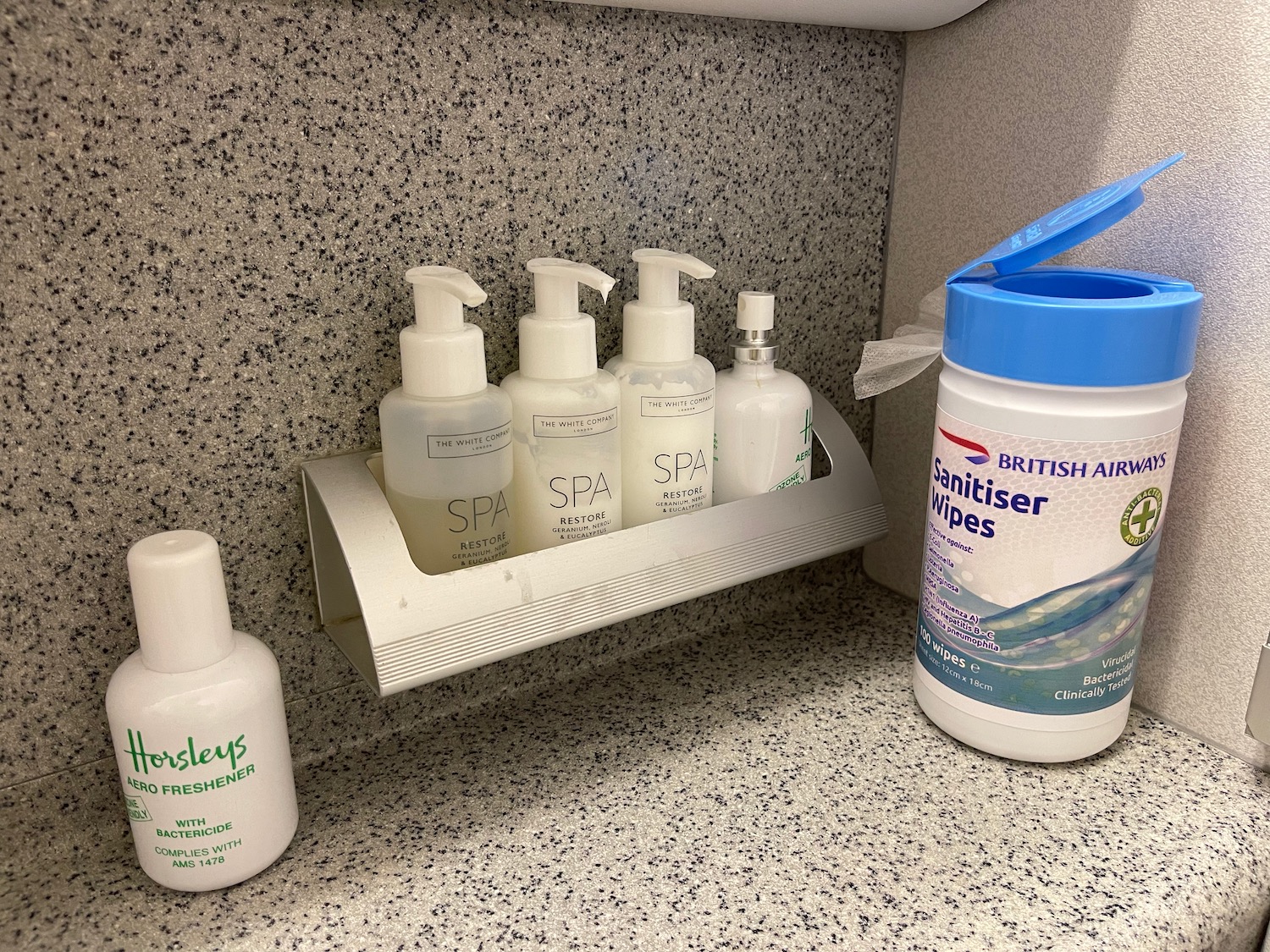 a group of hand sanitizers on a shelf