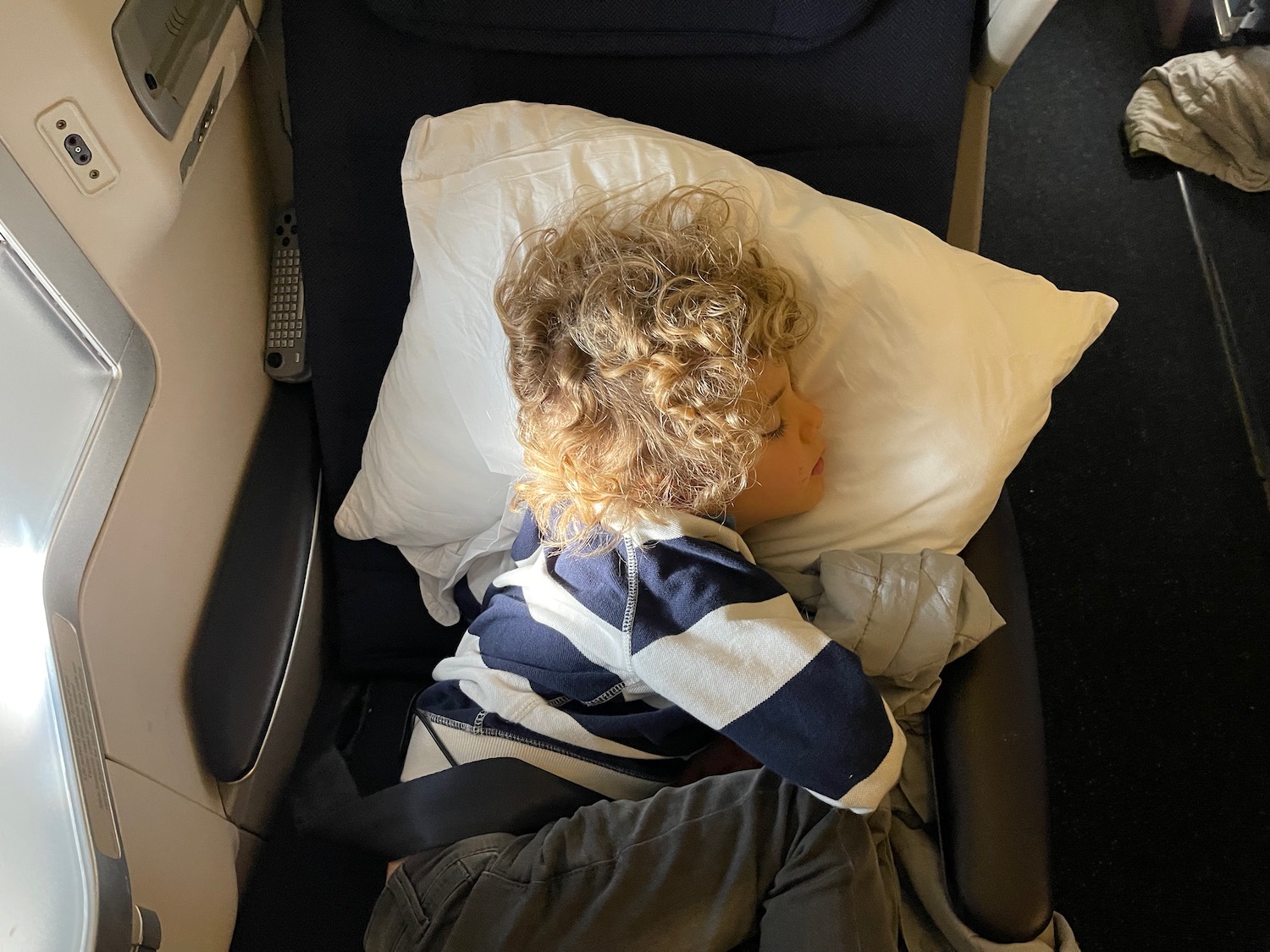 a child sleeping on a pillow