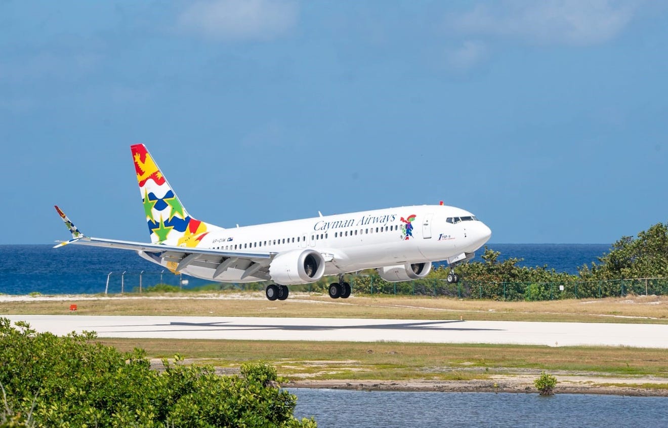 a white airplane taking off