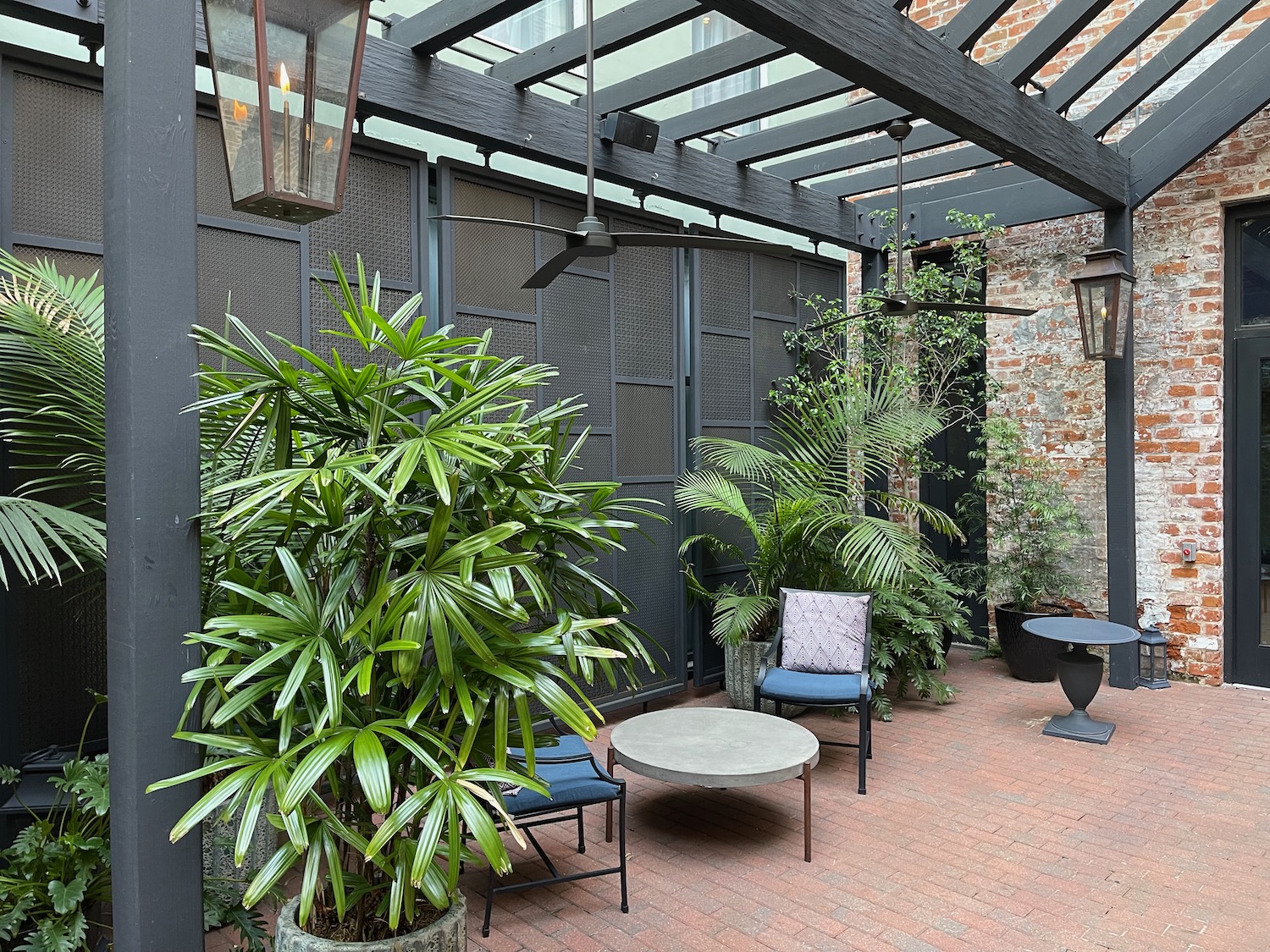 a patio with chairs and tables