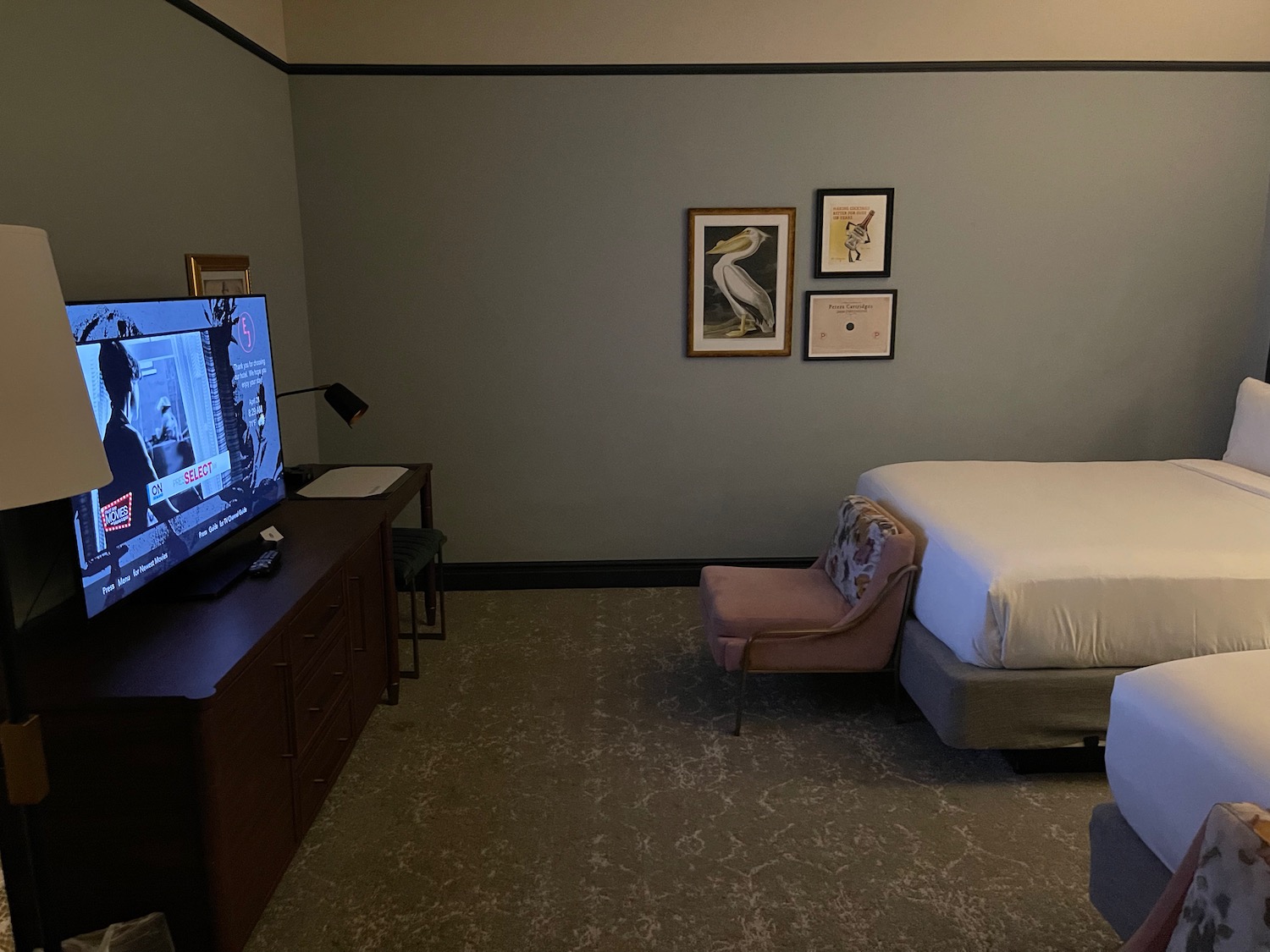 a bedroom with a bed and a television