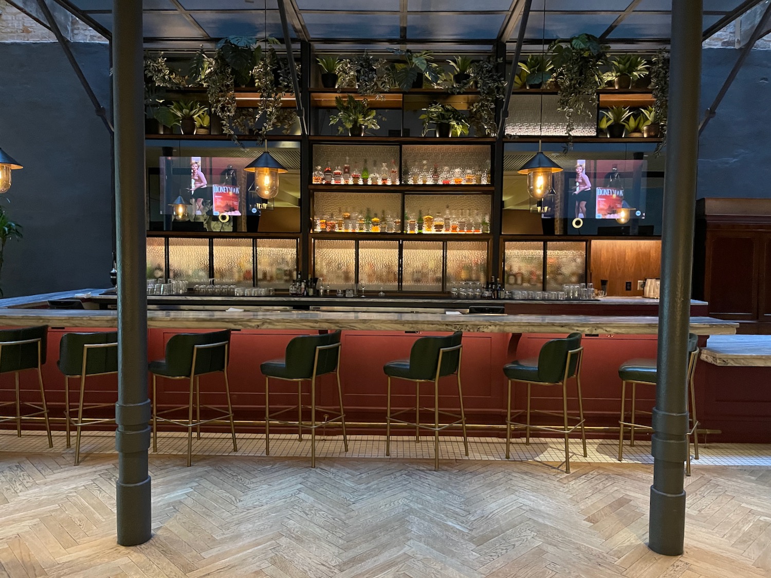 a bar with chairs and shelves