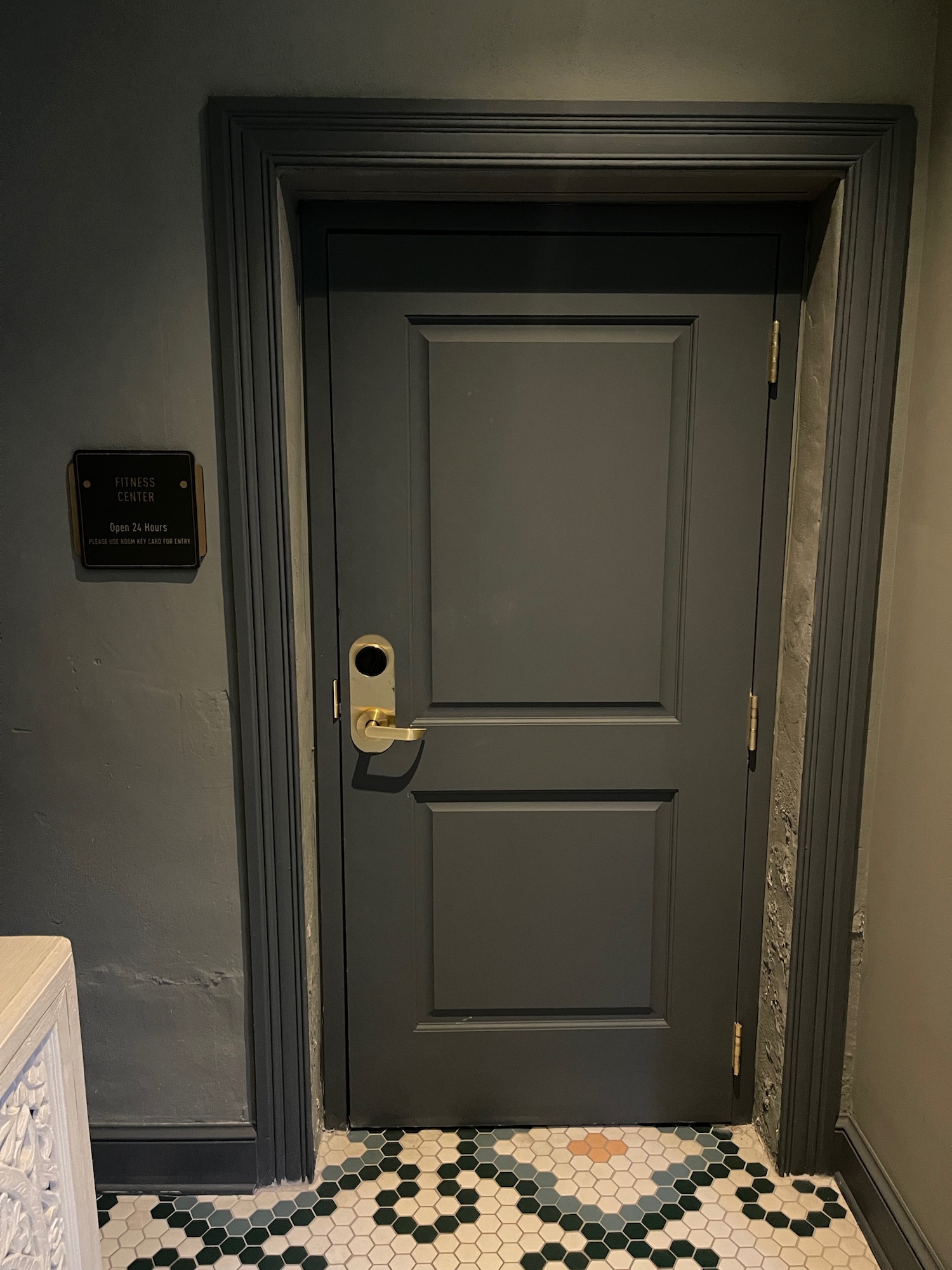 a door with a gold handle