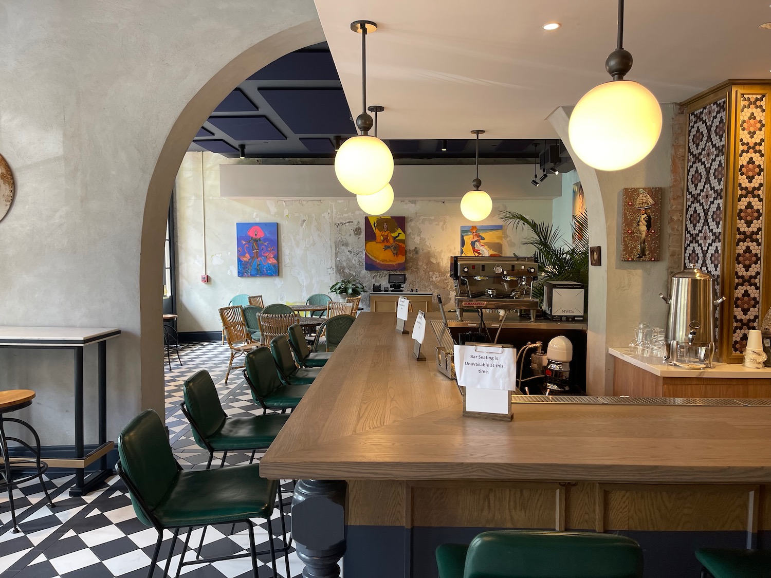 a restaurant with a bar and chairs