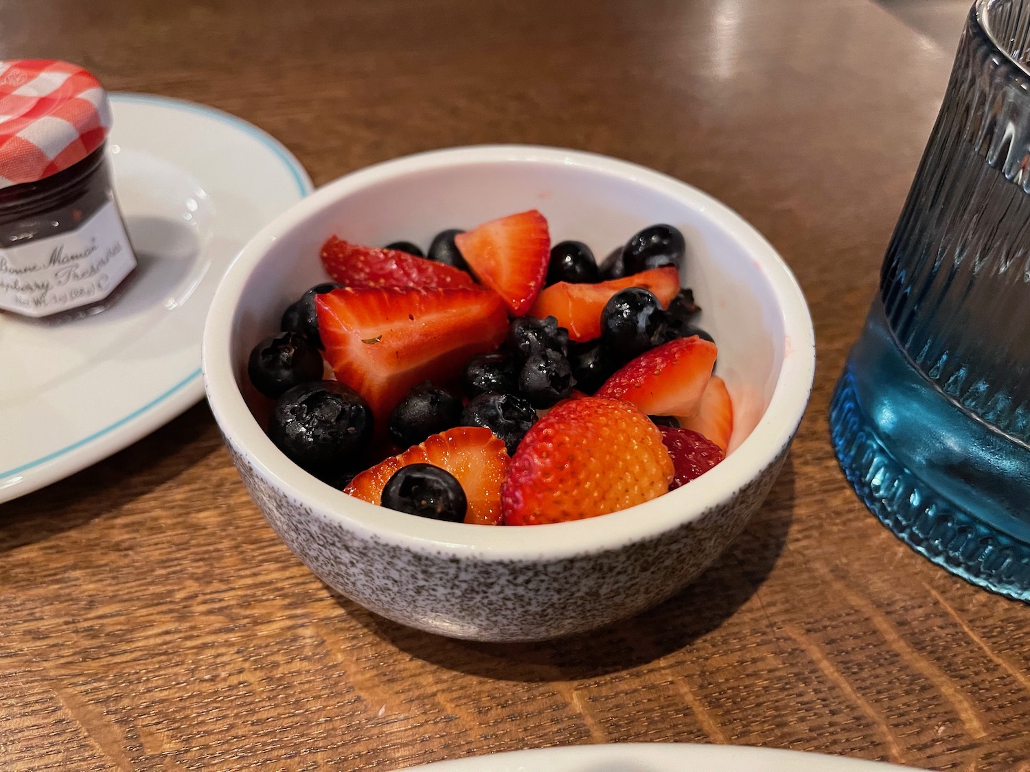 a bowl of fruit on a table