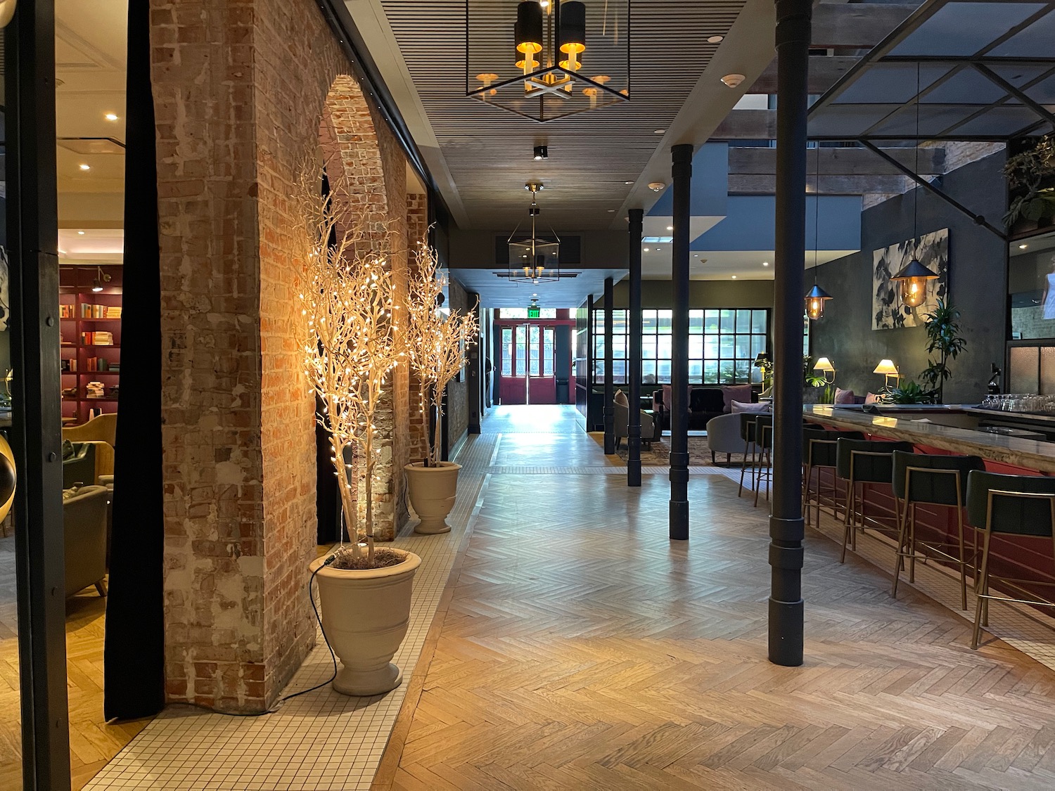 a room with brick walls and a brick wall and a brick archway