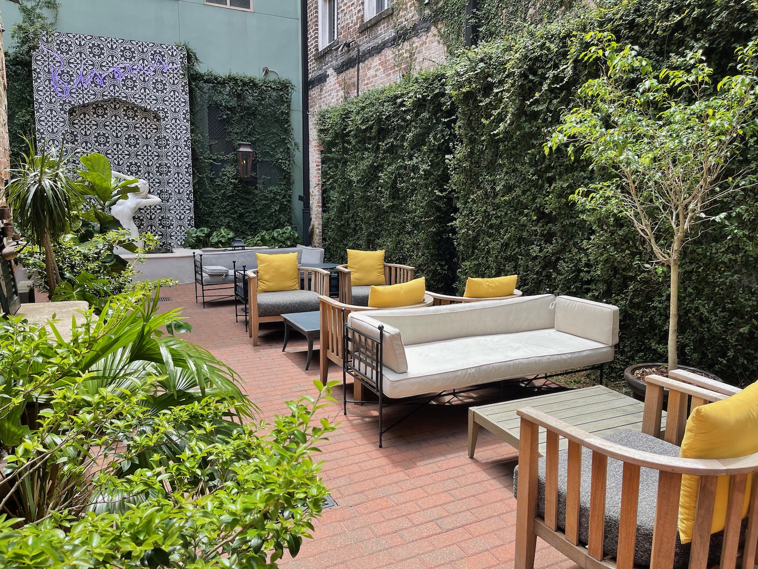 a patio with furniture and plants