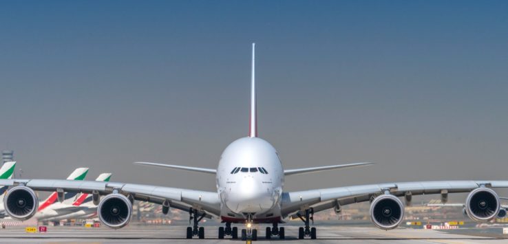 a large white airplane on a runway