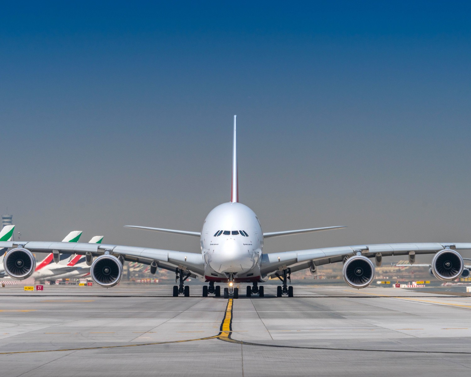 a large white airplane on a runway