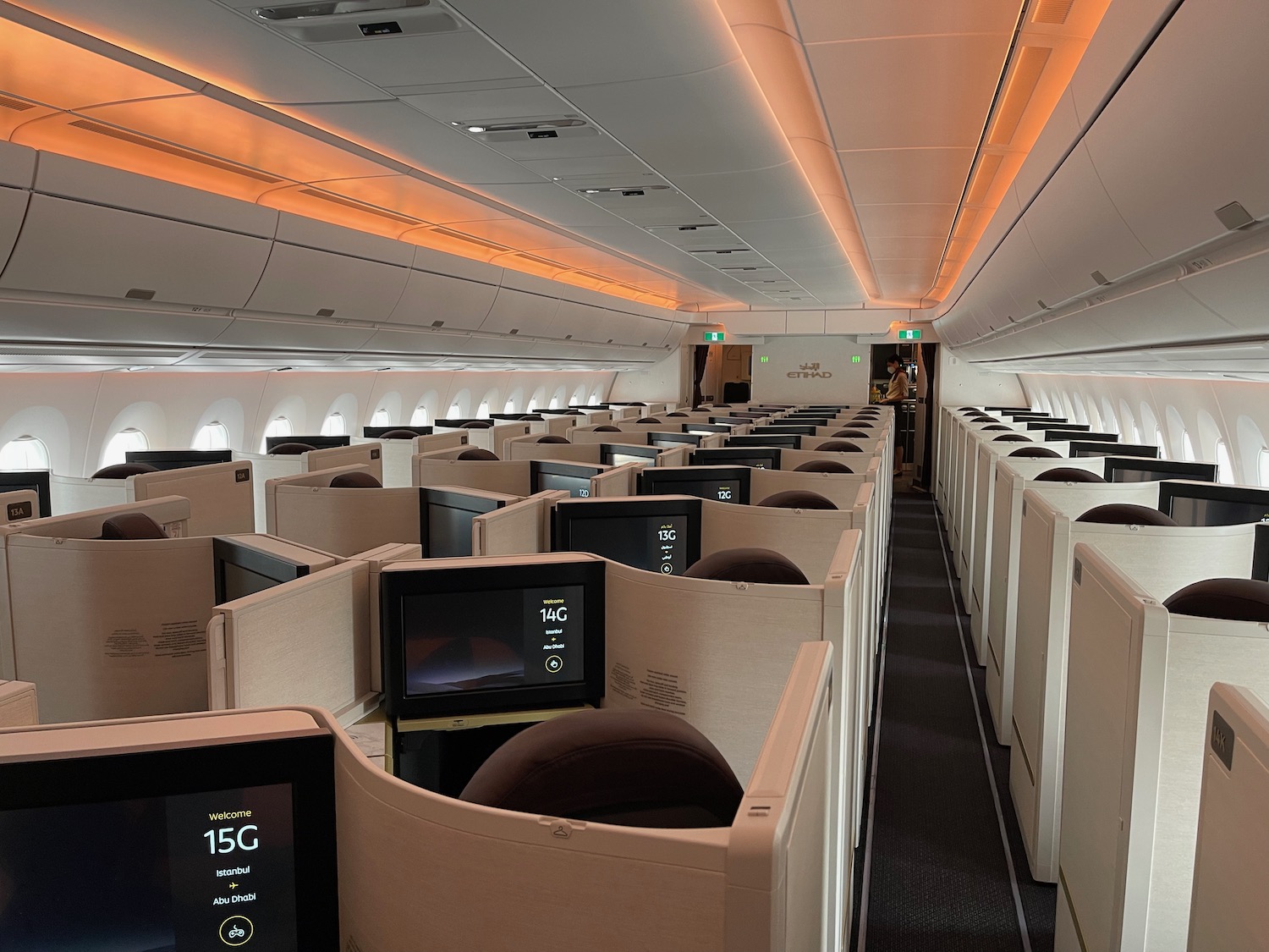 an airplane with rows of seats and computers