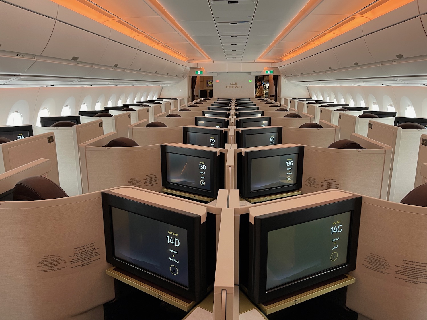 a row of monitors in an airplane