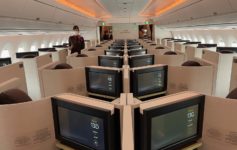 a row of monitors in an airplane