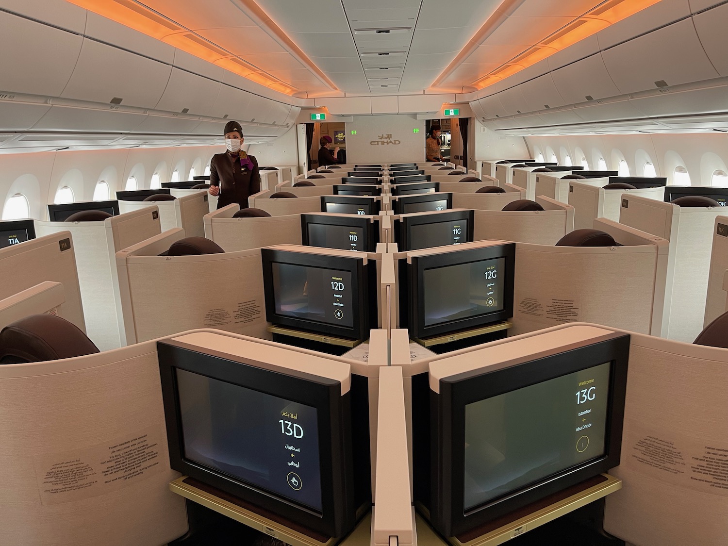 a row of monitors in an airplane