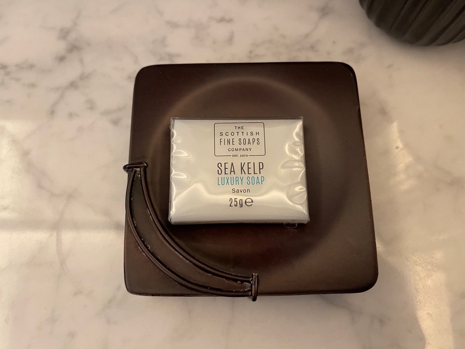 a bar of soap on a brown leather case