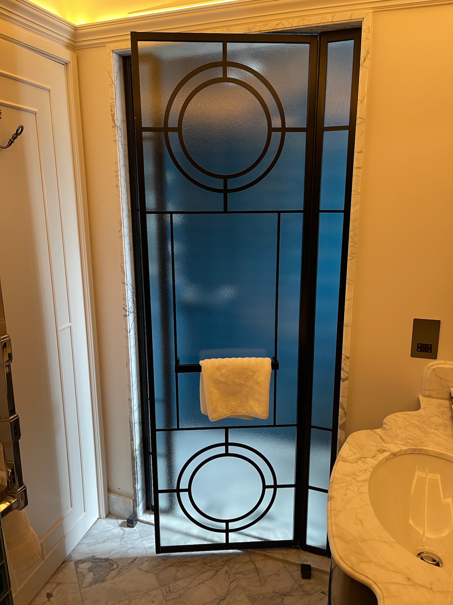 a glass door with a towel on it
