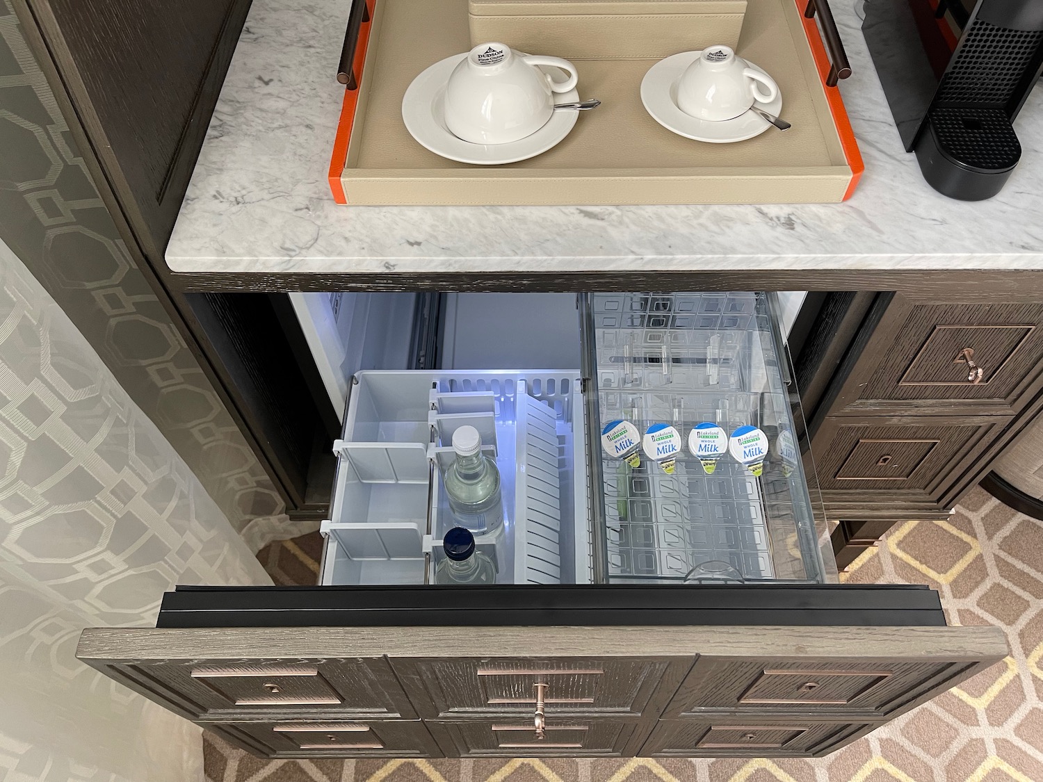 a kitchen cabinet with a drawer open