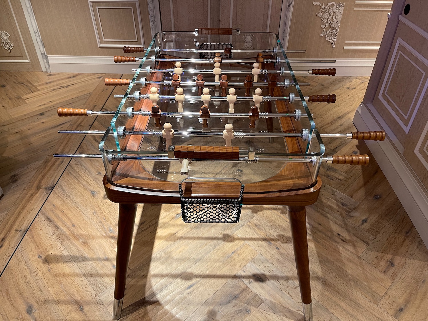 a foosball table with wood sticks