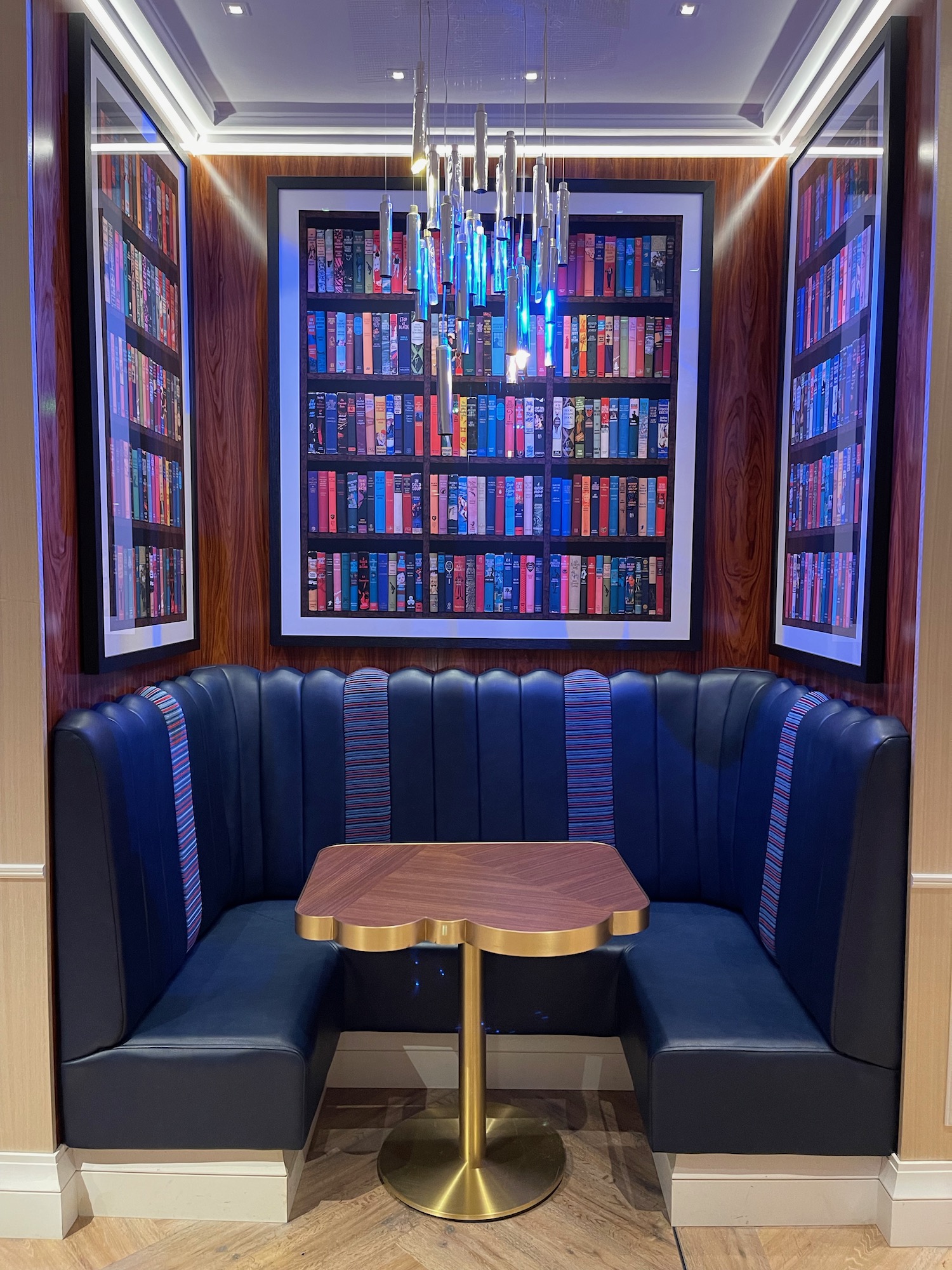 a booth with a table and a chandelier