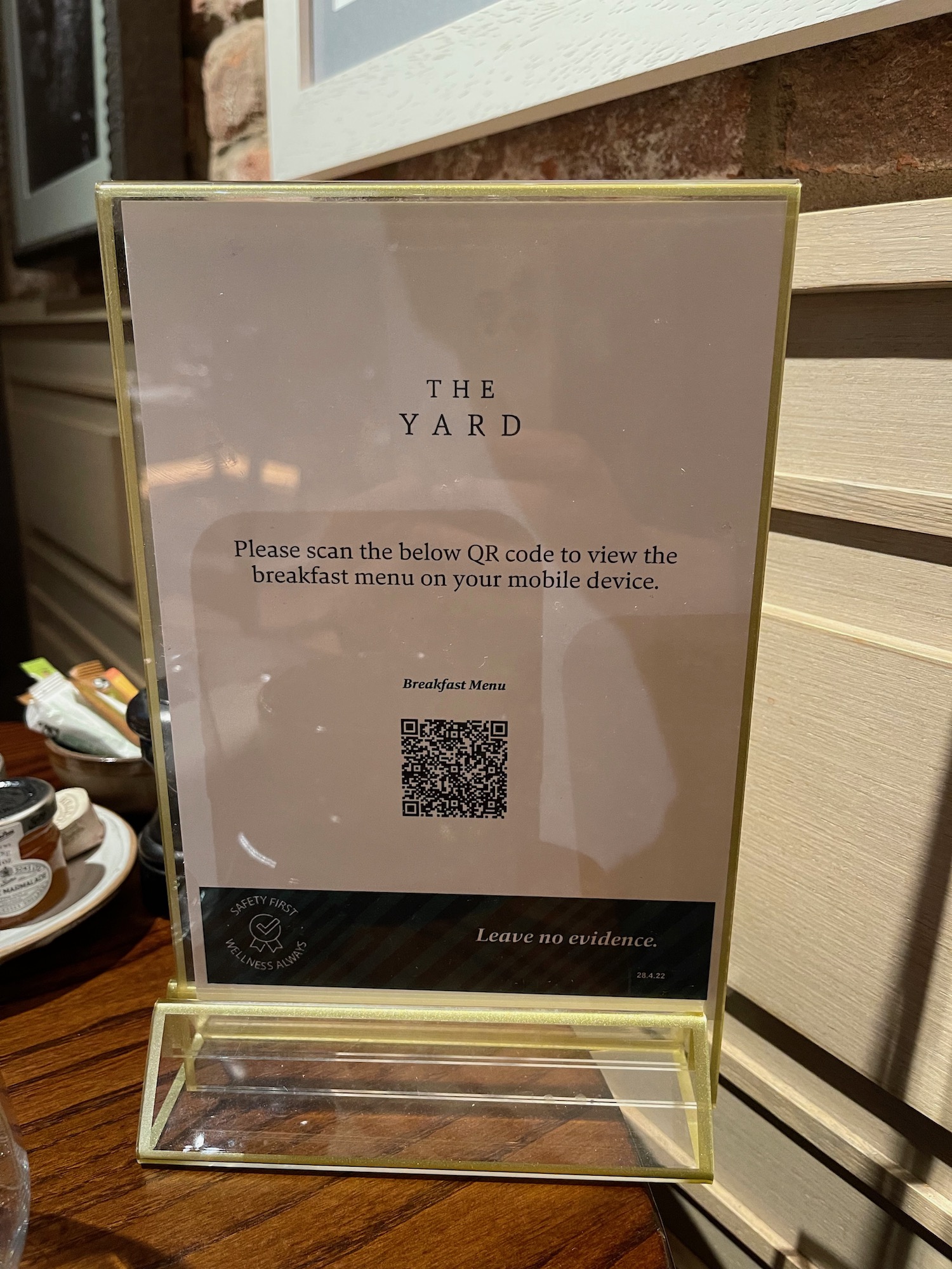 a clear plastic sign with a qr code on it
