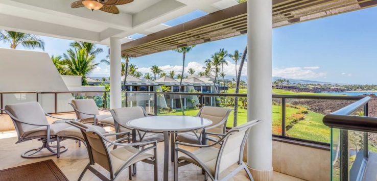 a patio with a table and chairs