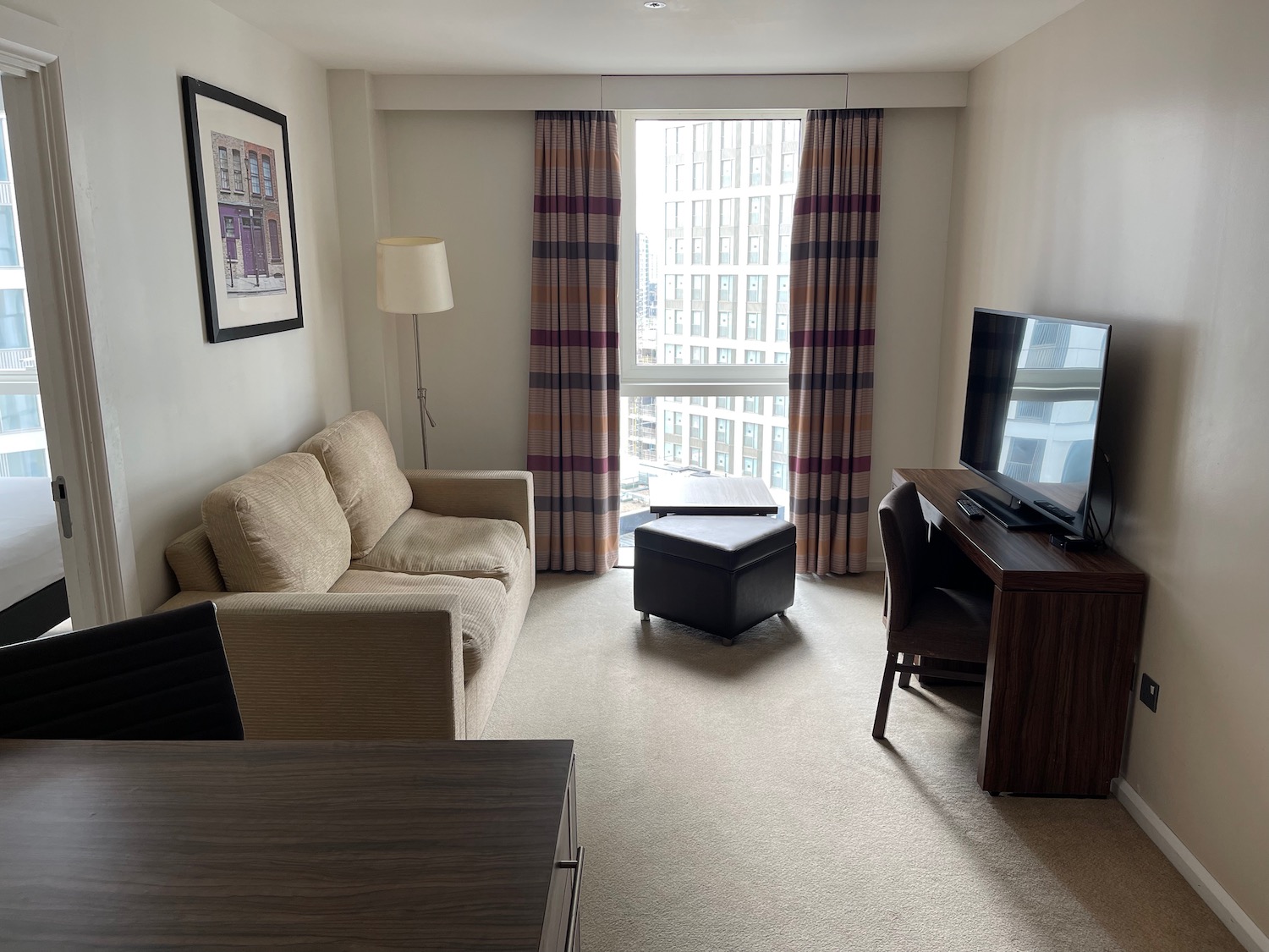 a living room with a television and a table