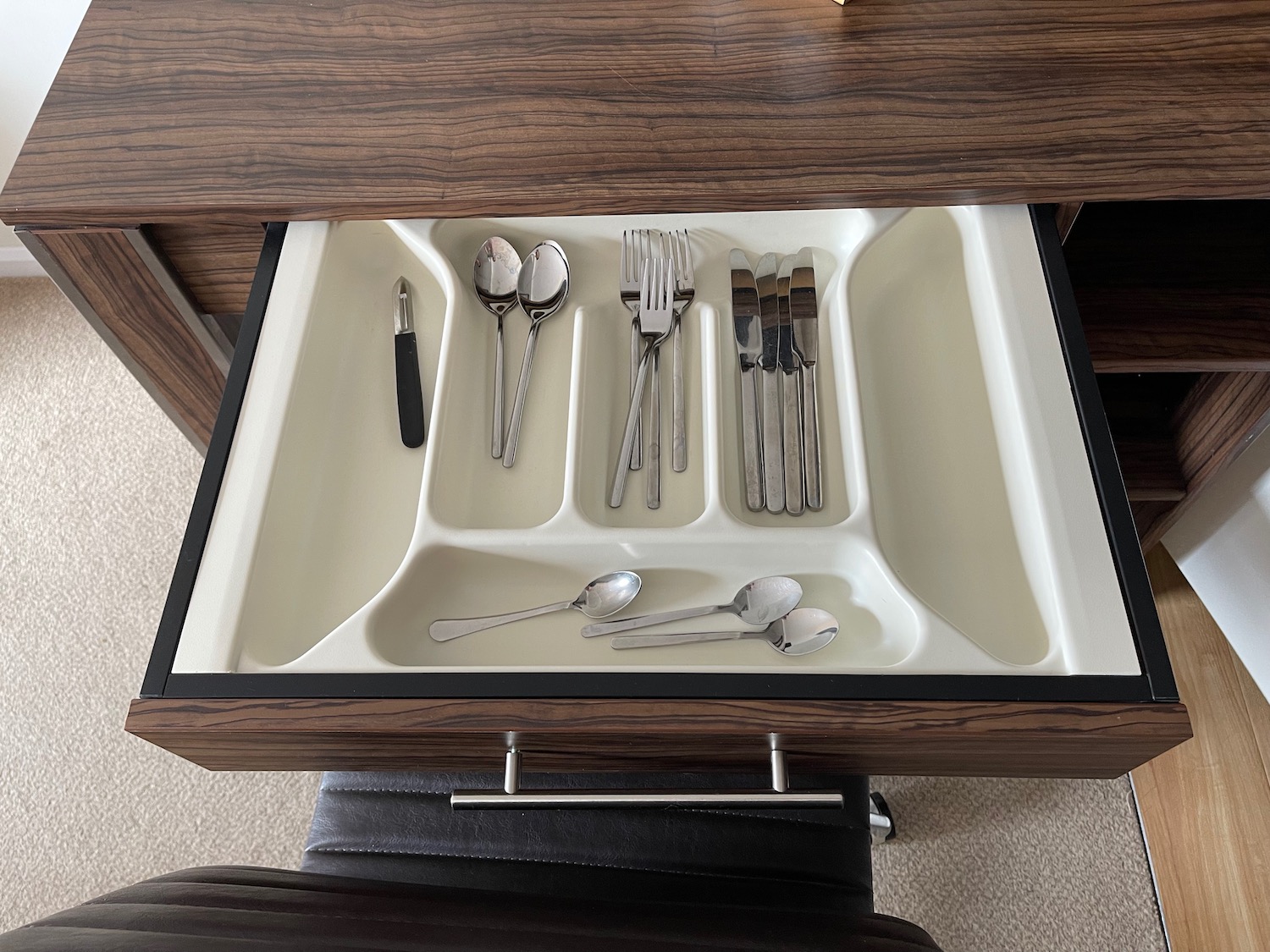 a drawer with silverware in it