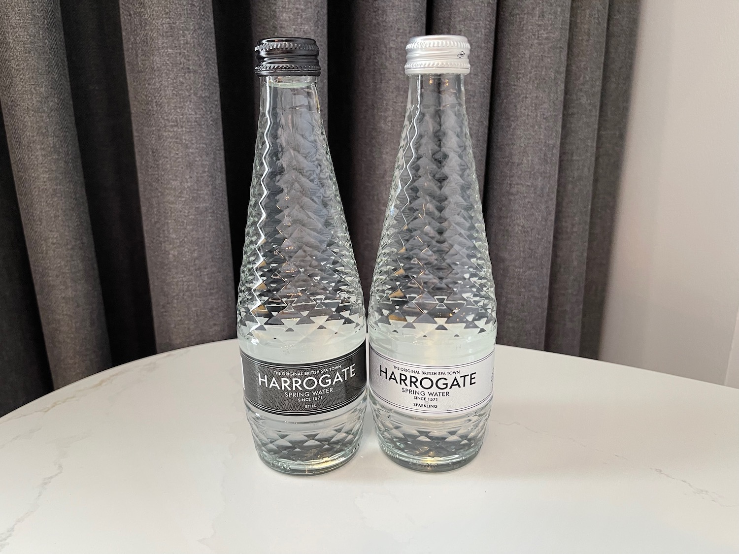 two bottles of water on a table