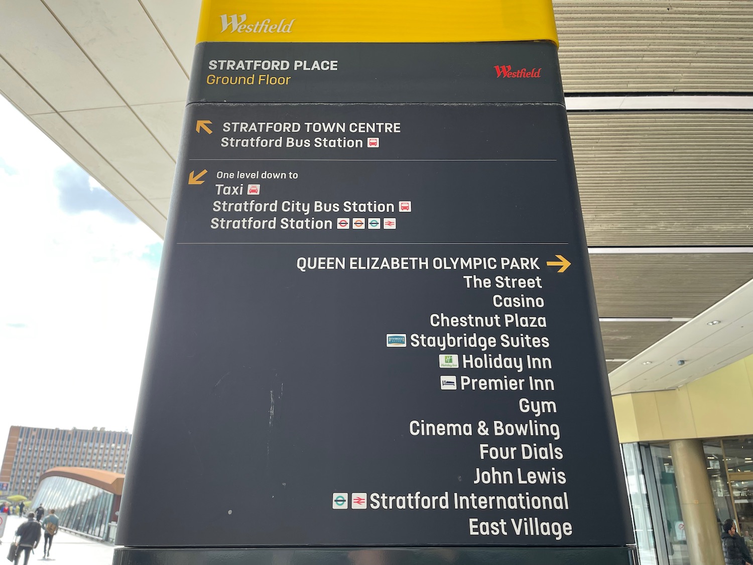 a sign with white text and yellow text