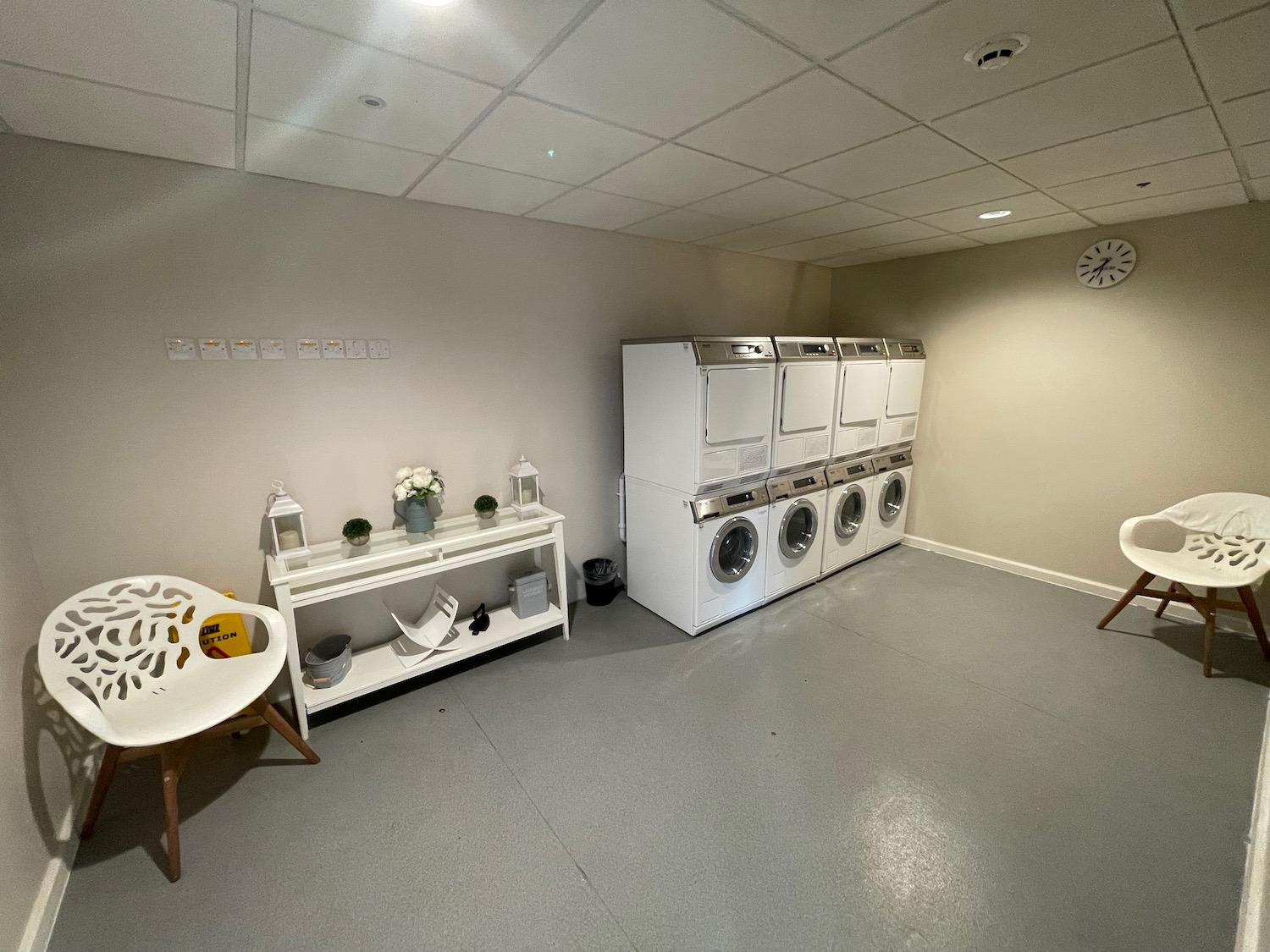 a laundry room with white appliances