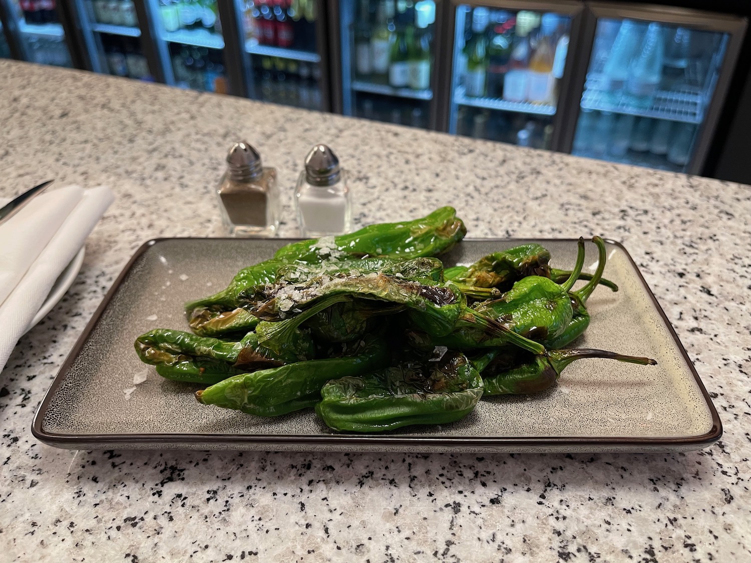 a plate of green peppers