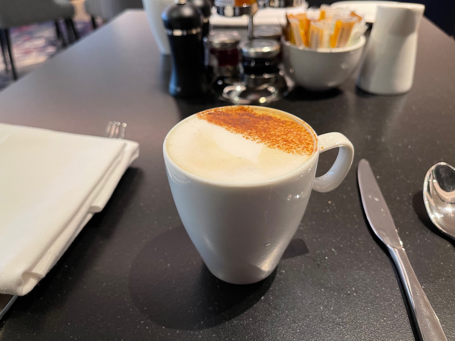 a white cup with brown powder in it