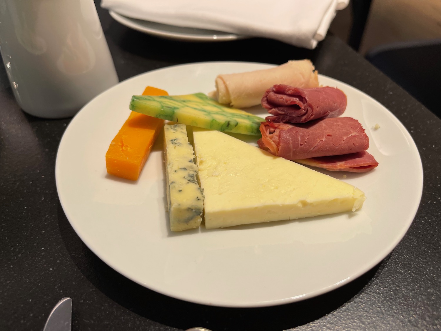 a plate of cheese and meat