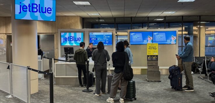 people standing in front of a computer
