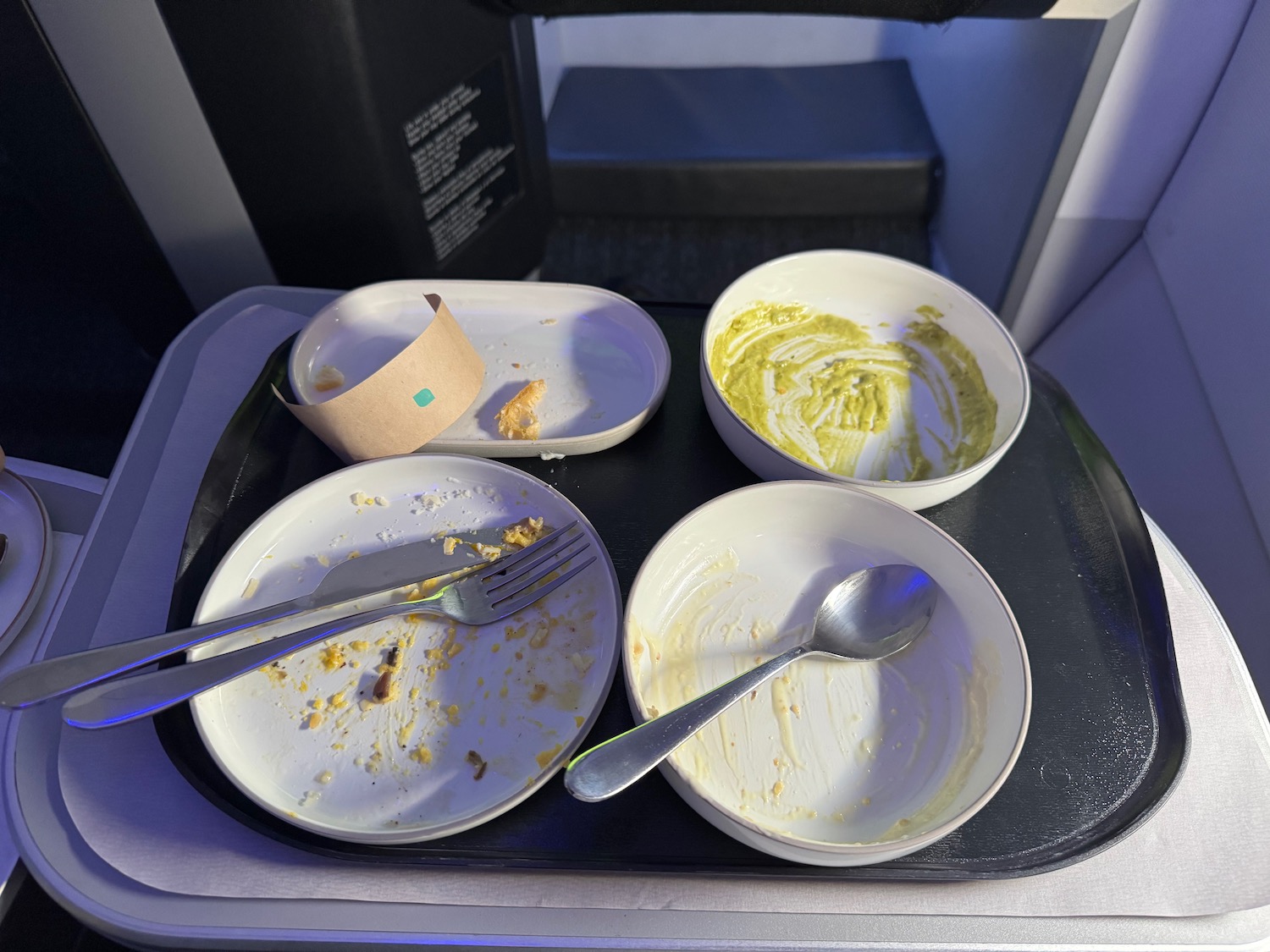 a tray with empty bowls and utensils