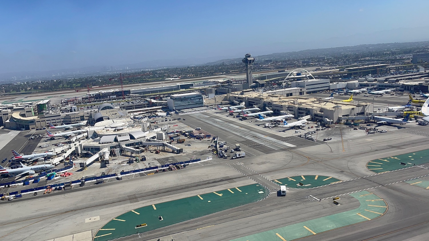 an airport with planes parked on the runway