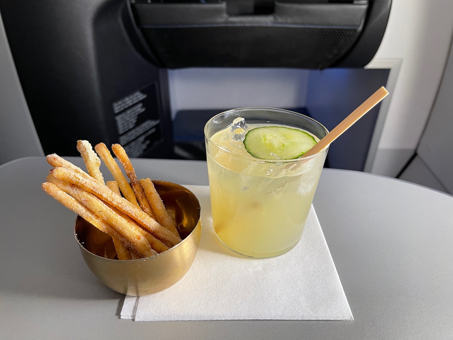 a bowl of food next to a drink