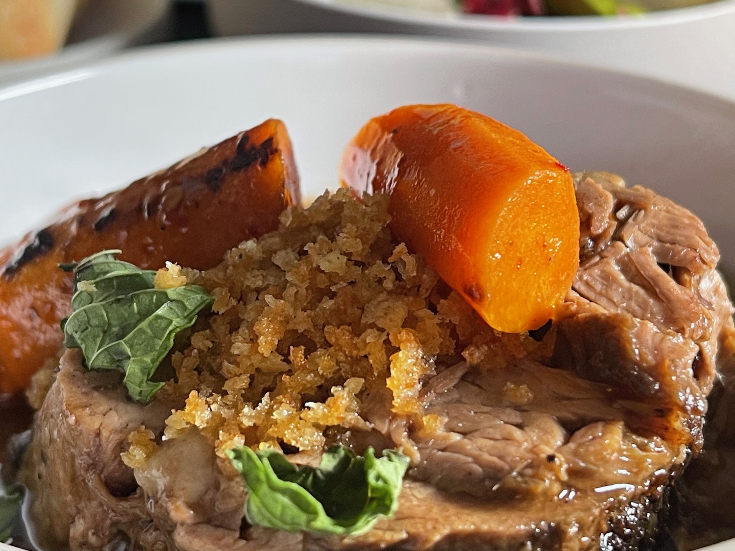 a plate of food with meat and vegetables