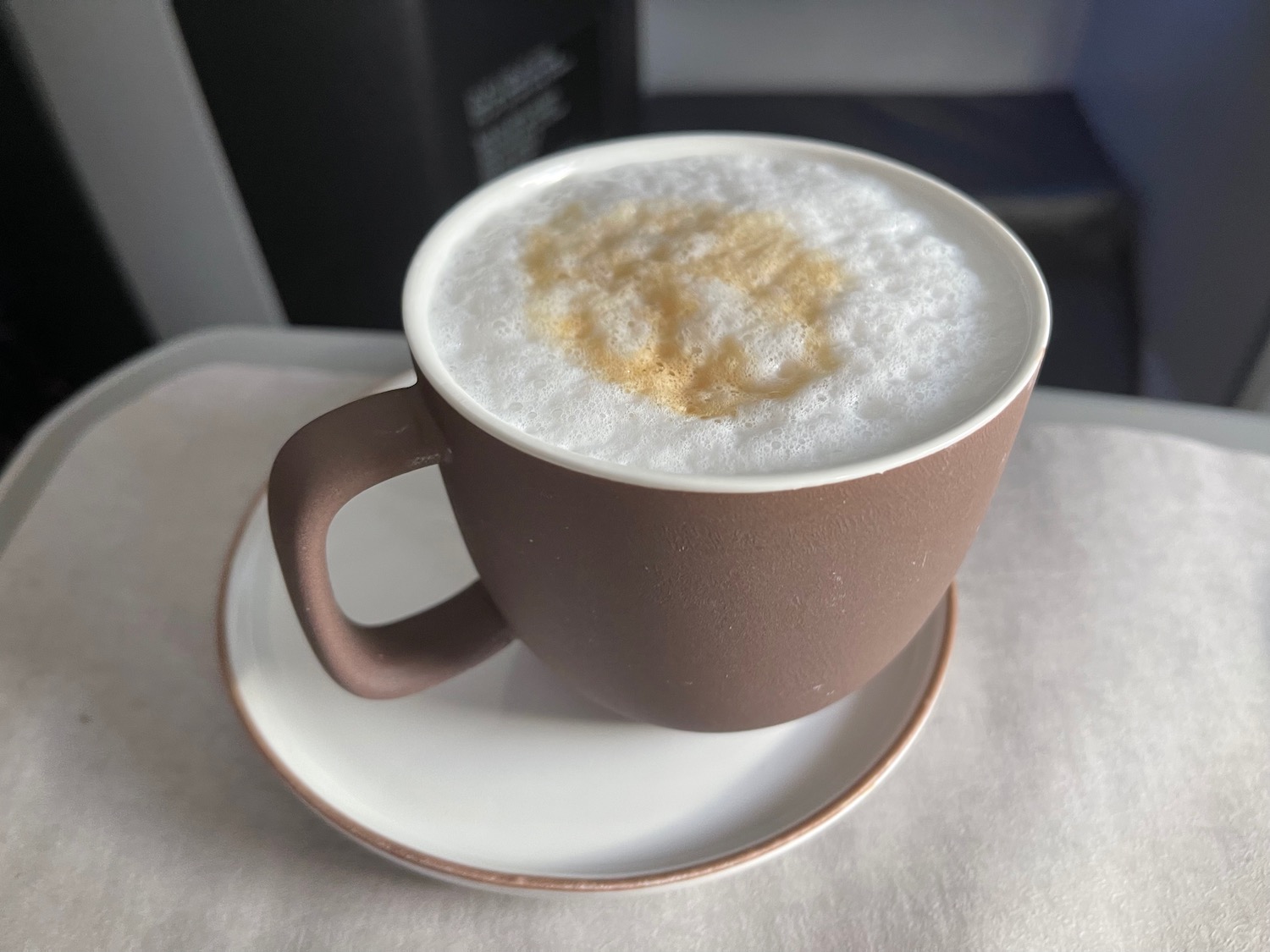 a cup of coffee with foam