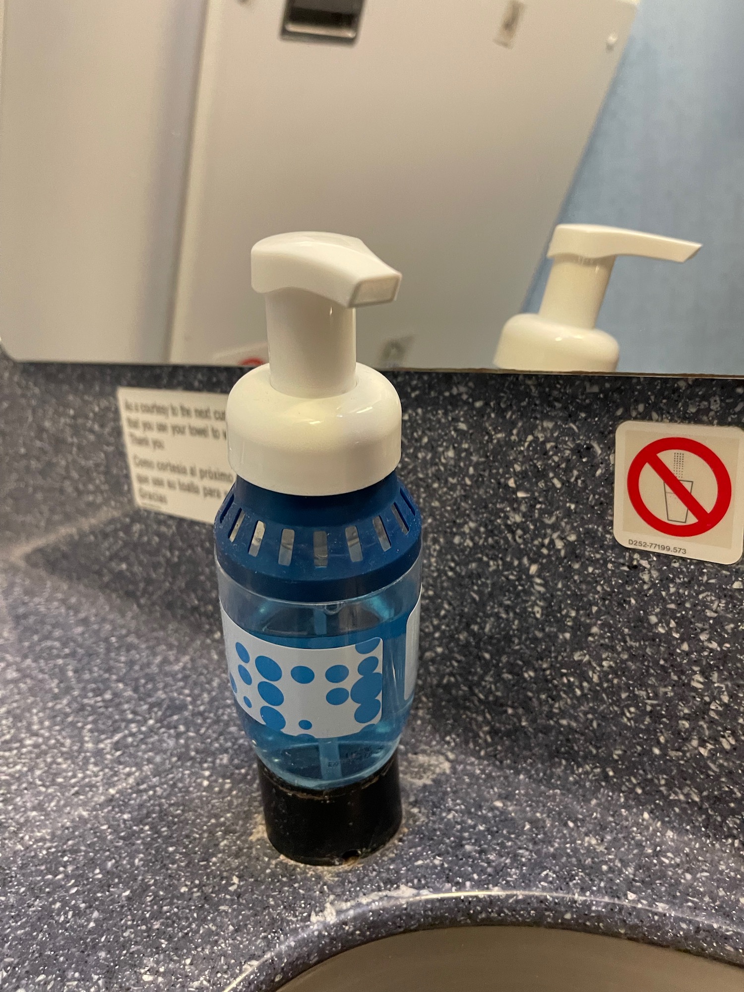 a soap dispenser on a counter