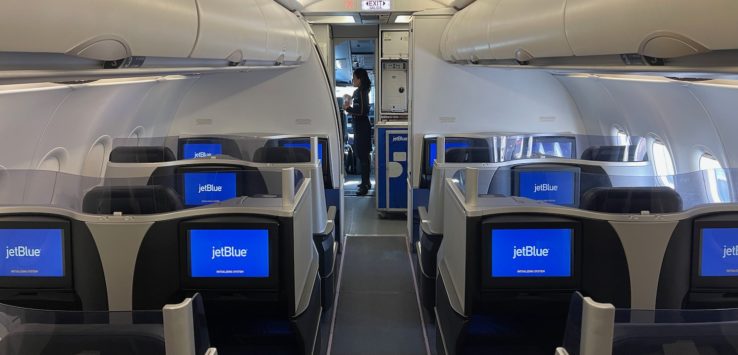 an airplane with seats and monitors