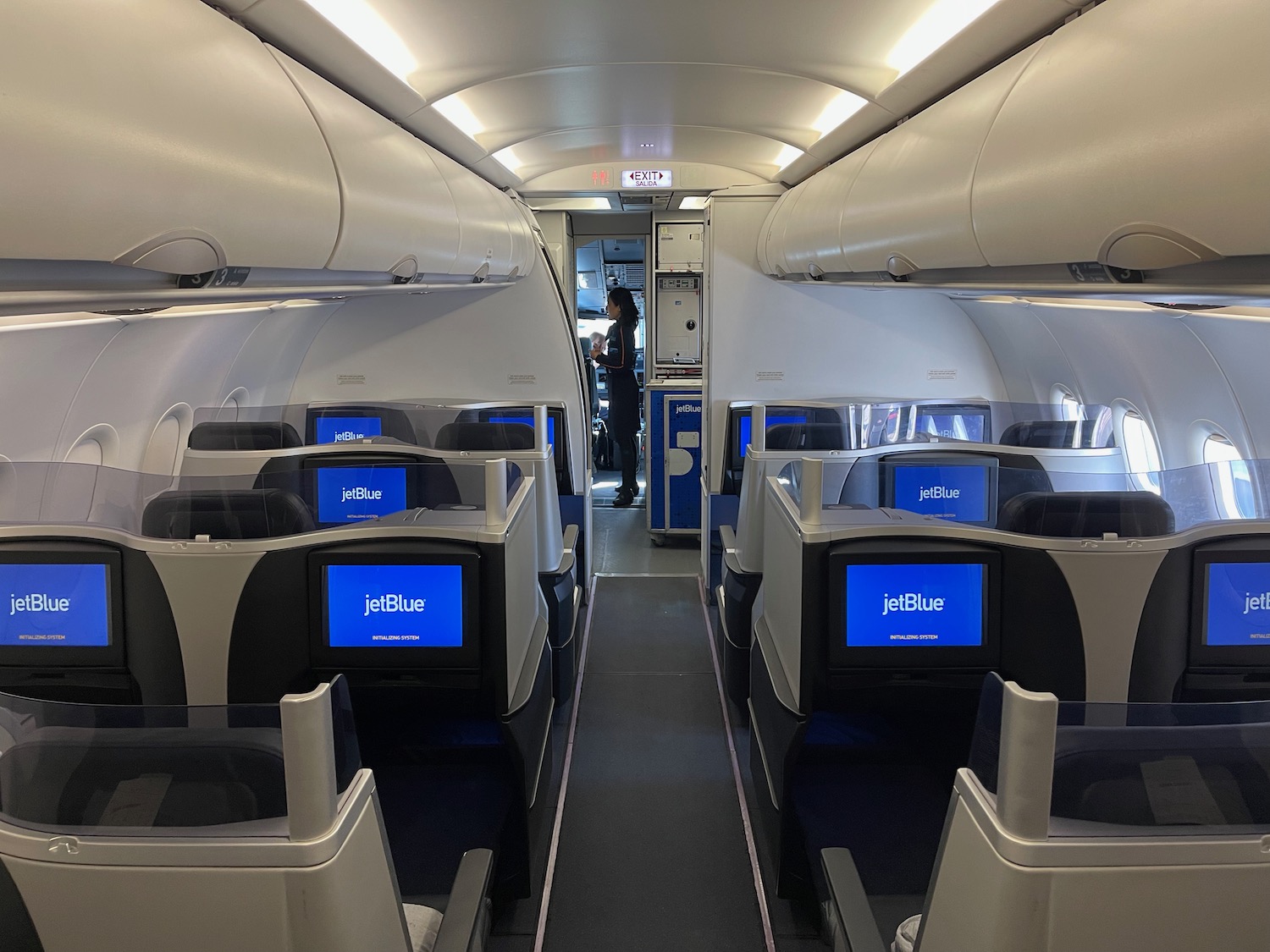 an airplane with seats and monitors